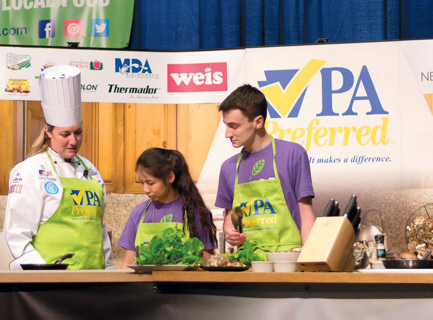 Students from the L.E.A.F. youth leadership program join Chef Autumn Patti on the Culinary Connections stage