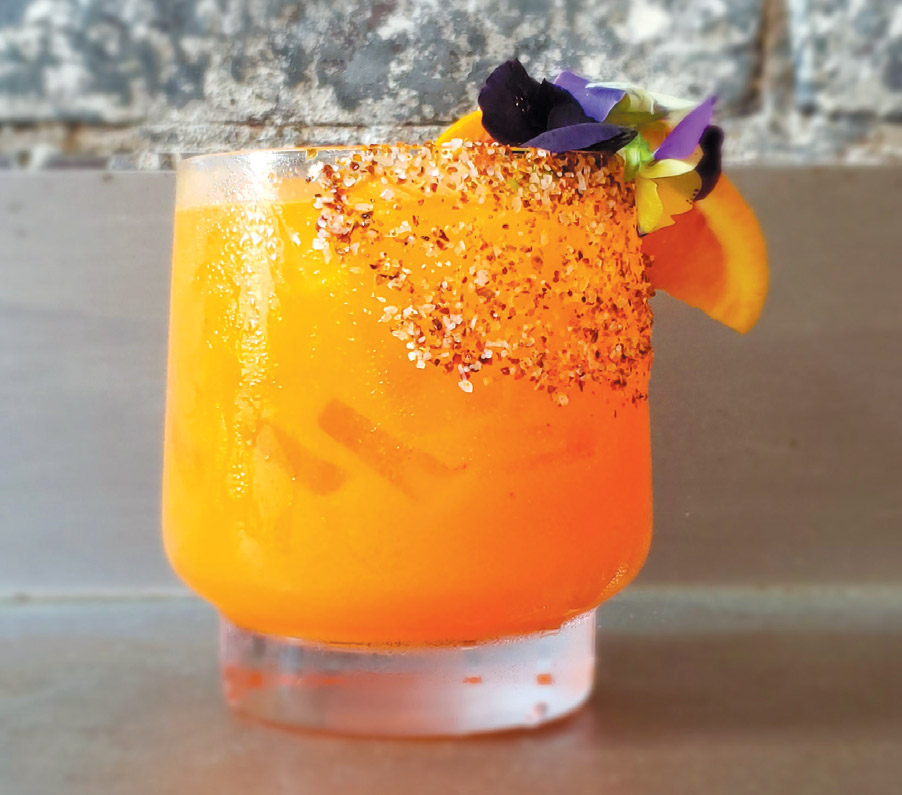 Cheers! A carrot-orange-mezcal cocktail from Vicio Mezcal: Drink Photo Courtesy Of Dock Street Brewing