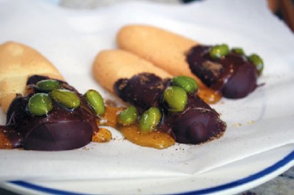 Cookies topped with hot chocolate sauce, crushed limes and edamame