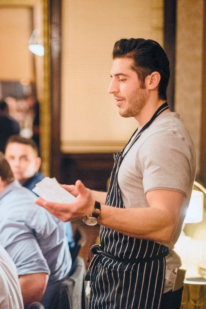 Ryan Fitzgerald presents the menu to diners at Boku